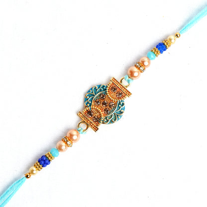 Beautiful Designer Blue Pearl Rakhi for Brother Comes with Complimentary Roli Chawal