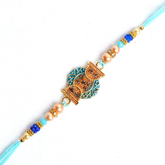 Beautiful Designer Blue Pearl Rakhi for Brother Comes with Complimentary Roli Chawal