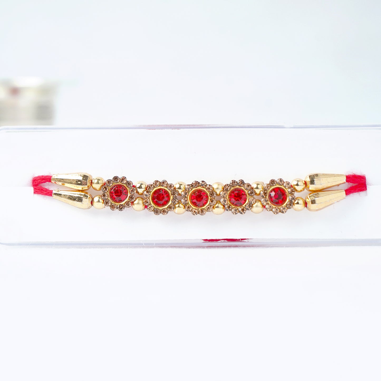 Designer Red Stone Rakhi for Brother Comes with Complimentary Roli Chawal