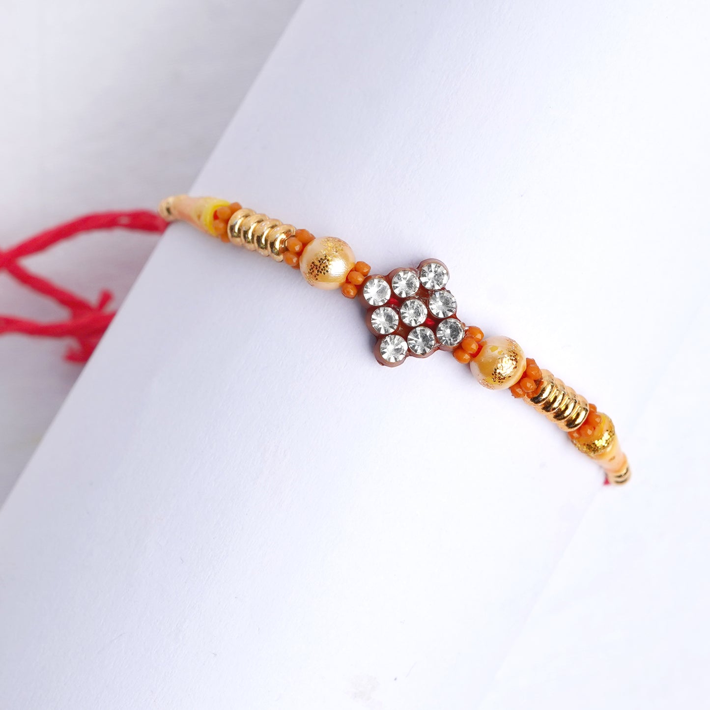 Designer White Stones Rakhi for Brother with Complimentary Roli Chawal