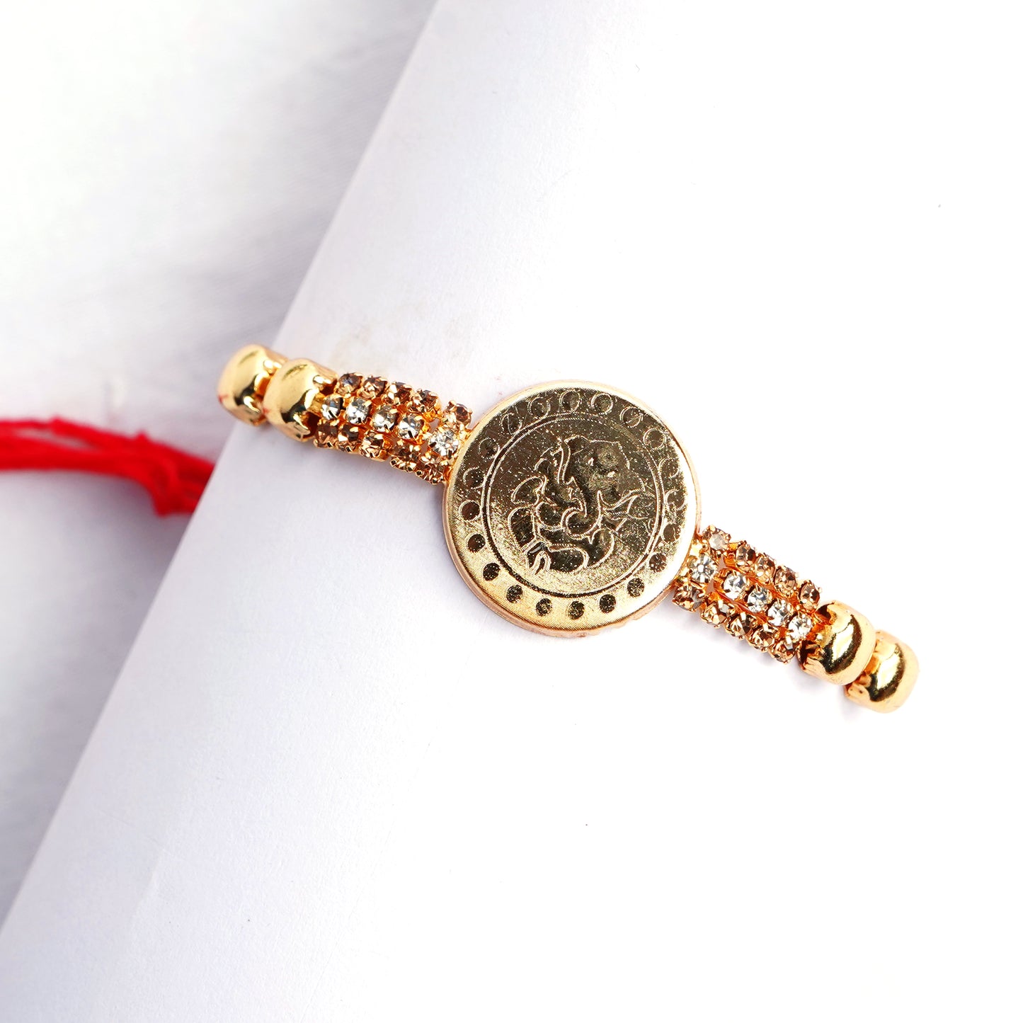 Traditional Coin Shape Ganesha Rakhi for Brother with Complimentary Roli Chawal